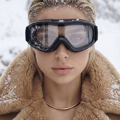 Ultra-high fashion winter beauty portrait, close-up. The woman looks straight in