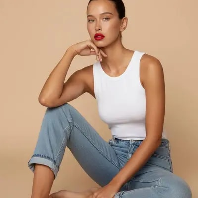 soft daylight portrait, minimal beige studio, natural pose, clean aest