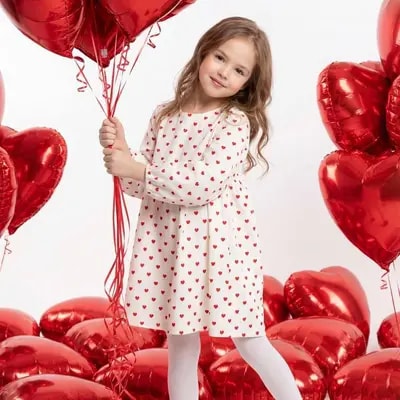 Use the child’s photo reference. A small model stands in the studio on