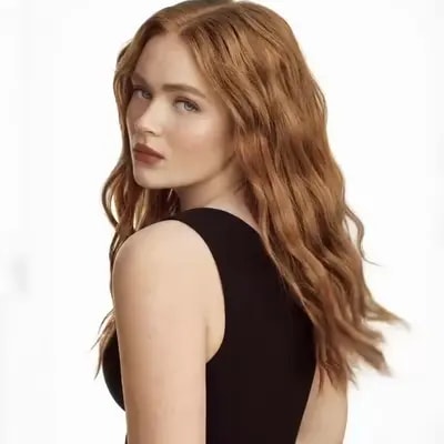 The camera is completely static, eye-level, medium close-up. No camera